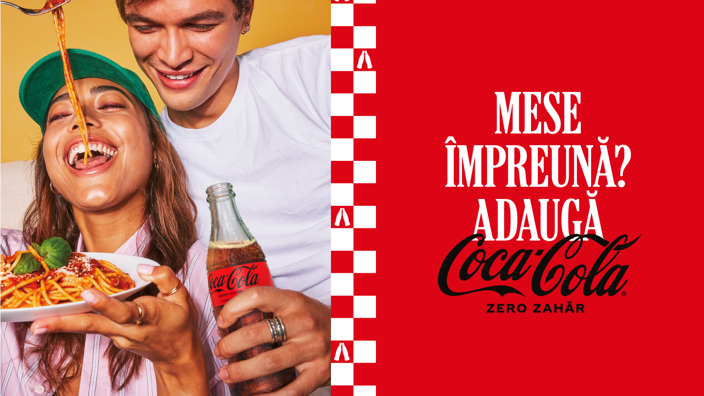 Doi tineri îndrăgostiți mănâncă paste și beau Coca-Cola Zero Zahăr
