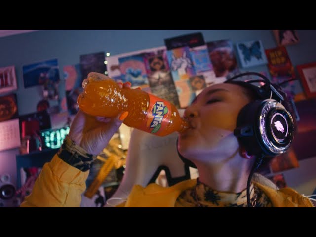 Girl drinking Fanta