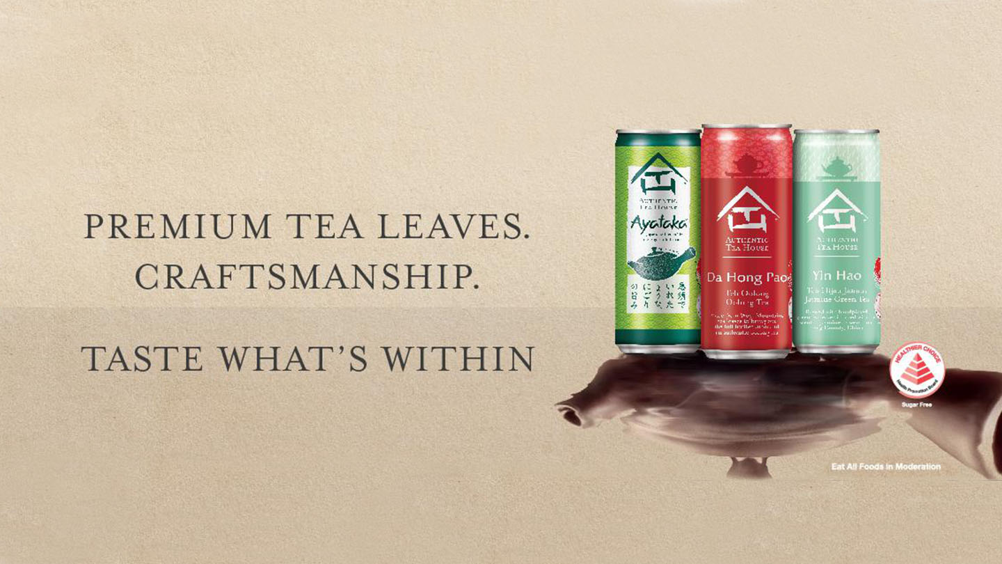 Three cans of Authentic Tea House varieties in a brown background