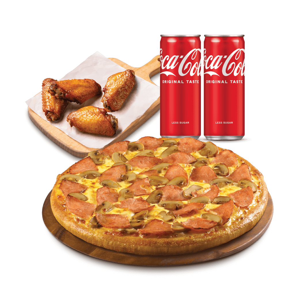 Chicken wings and pizza from Pizza Hut next to two cans of Coke.