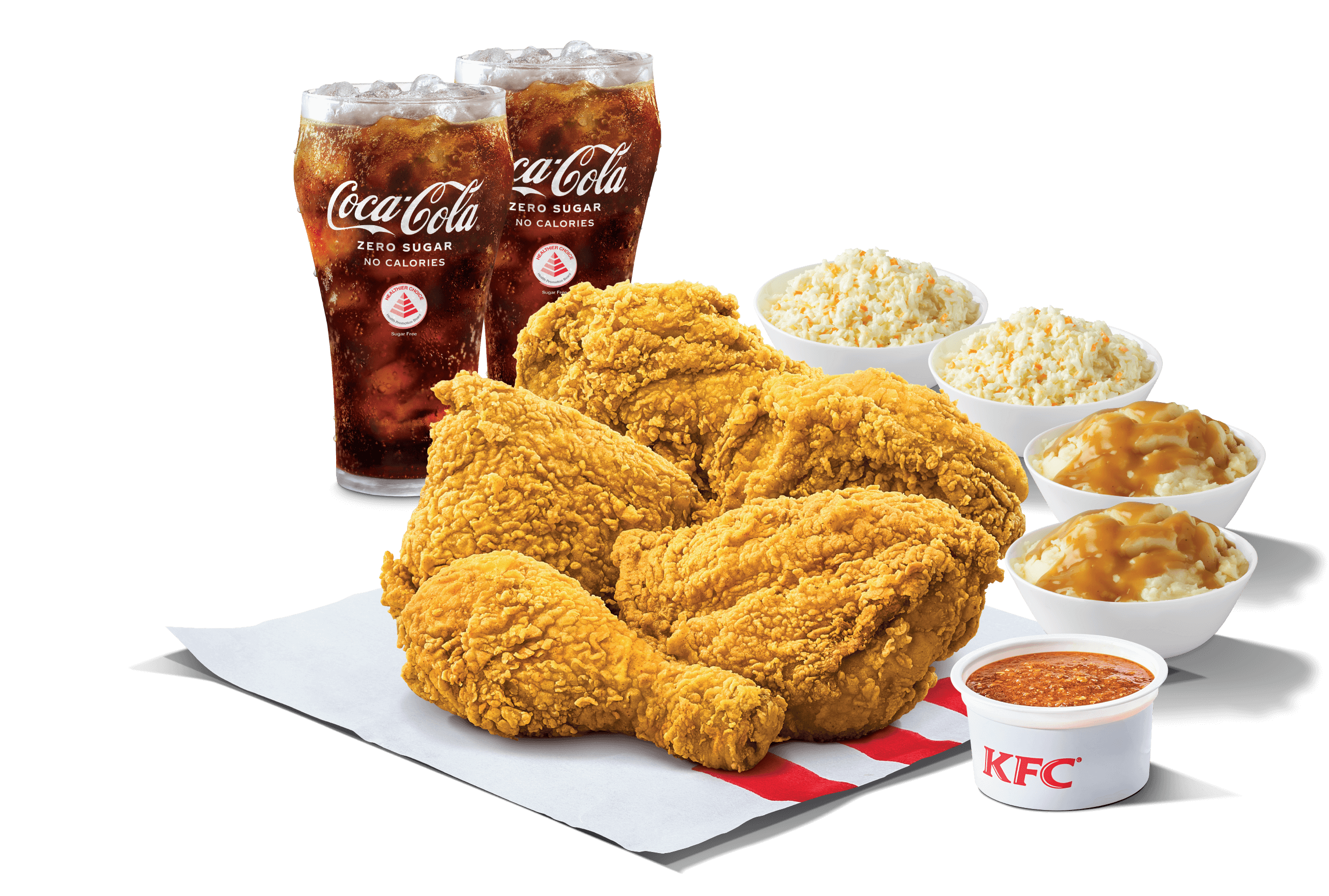 KFC's chicken and sauce next to two glass of Coca-Cola