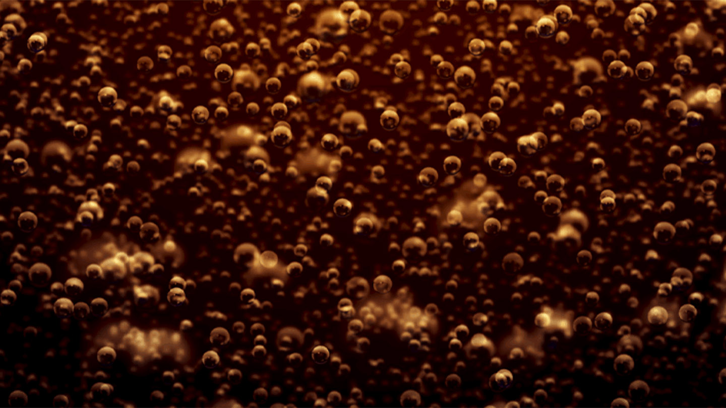 Detail of sparkling bubbles inside a Coca-Cola drink