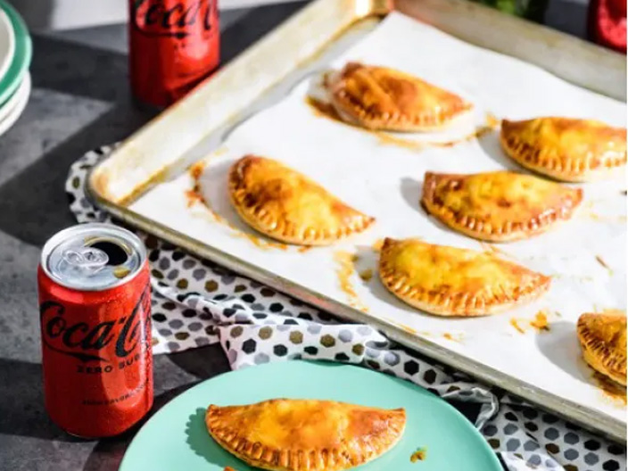 Beef and Chorizo Empanadas with Chimichurri and a can of Coca-Cola