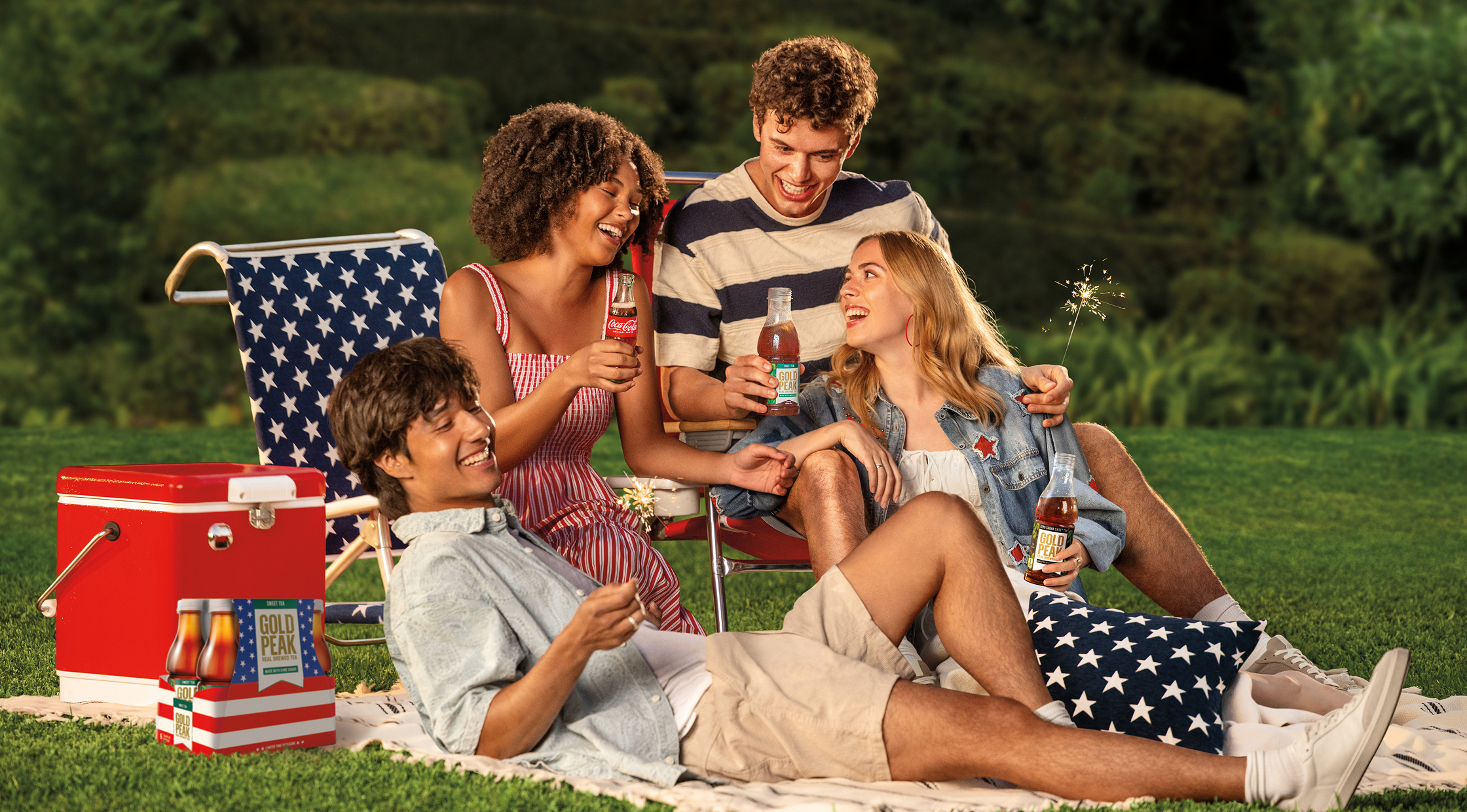 Friends hanging out outside drinking Coca-cola 