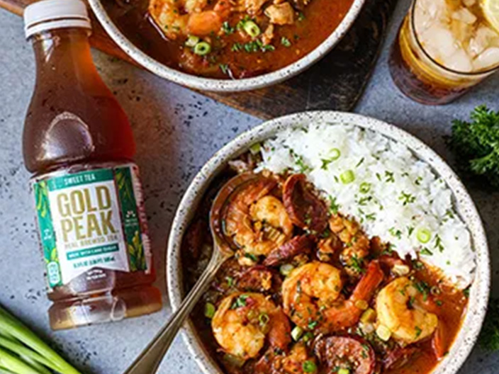 Gumbo with a bottle of Gold Peak Tea