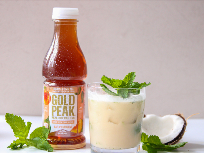 gold peak bottle next to creamy mocktail