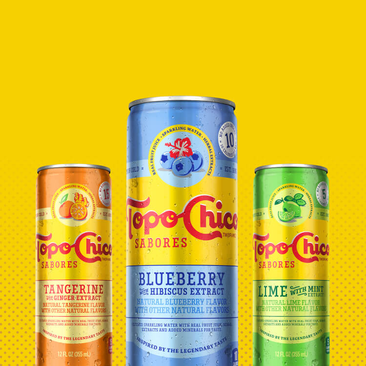 Three Topo Chico cans in a yellow background