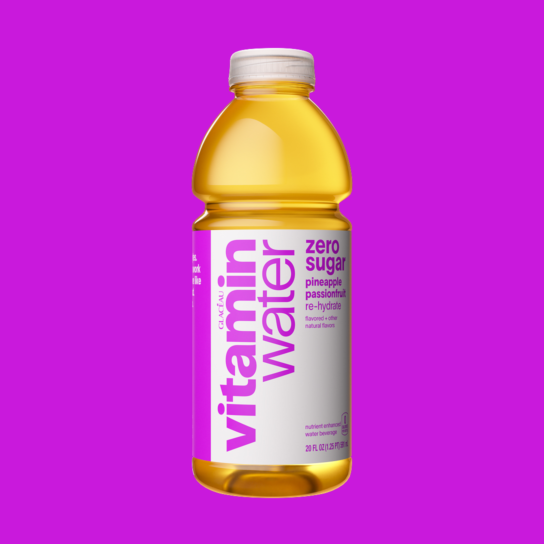a bottle of vitaminwater zero sugar pineapple passionfruit on a magenta background