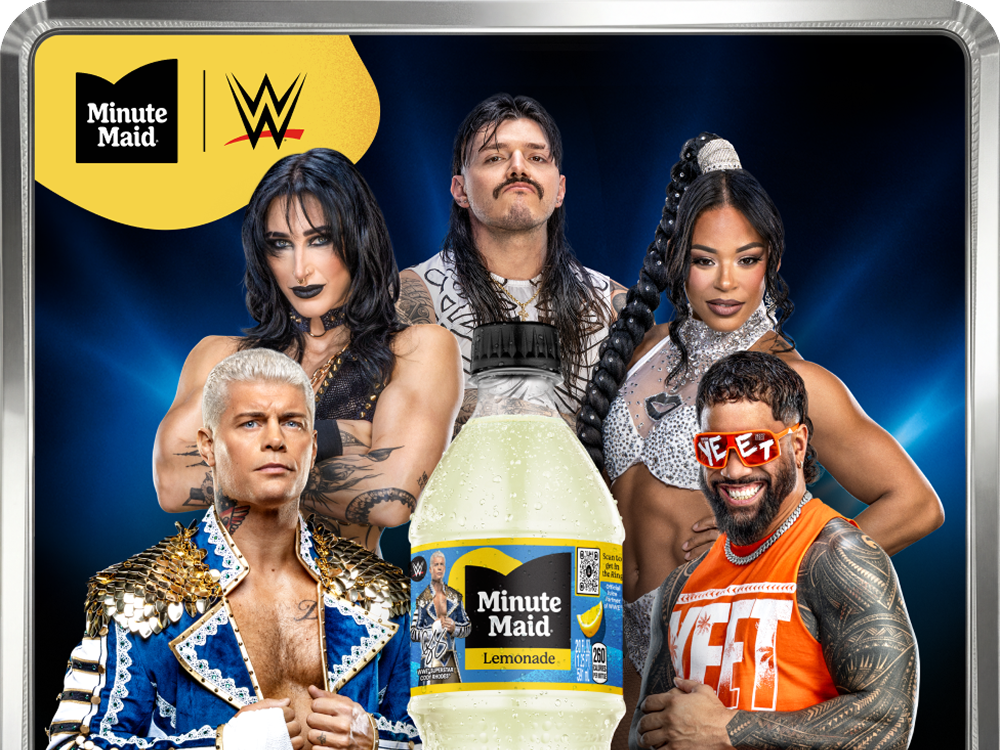 Group shot of WWE superstars with a bottle of Minute Maid Lemonade for the WWE Juice Vault contest, a brand partnership promotion.
