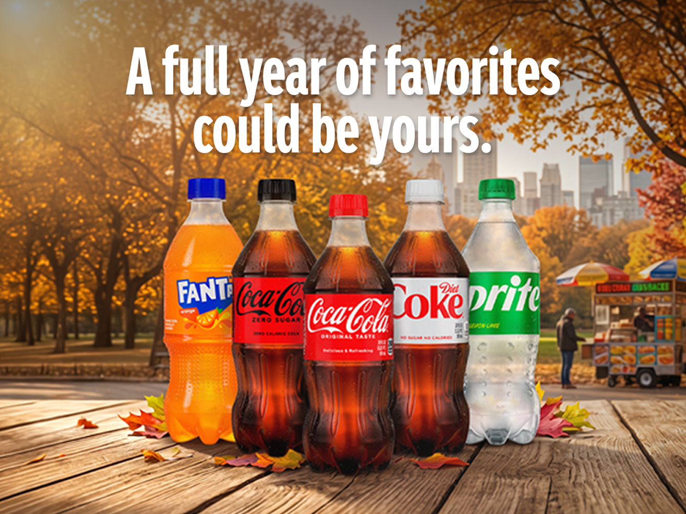 Assorted Coca-Cola products on an autumn park table promoting a sweepstakes to win a full year of favorites.