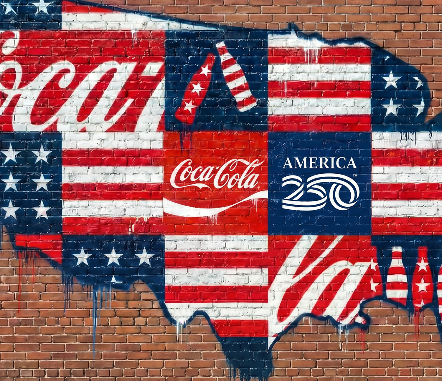 Patriotic brick wall mural featuring the Coca-Cola and America250 logos with red, white, and blue flag map details.