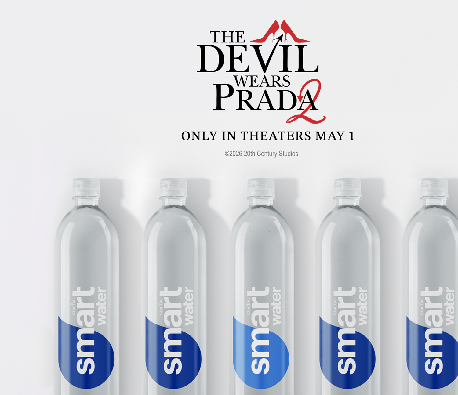 Row of smartwater bottles beneath The Devil Wears Prada 2 title treatment, promoting theatrical release only in theaters May 1 on clean white background