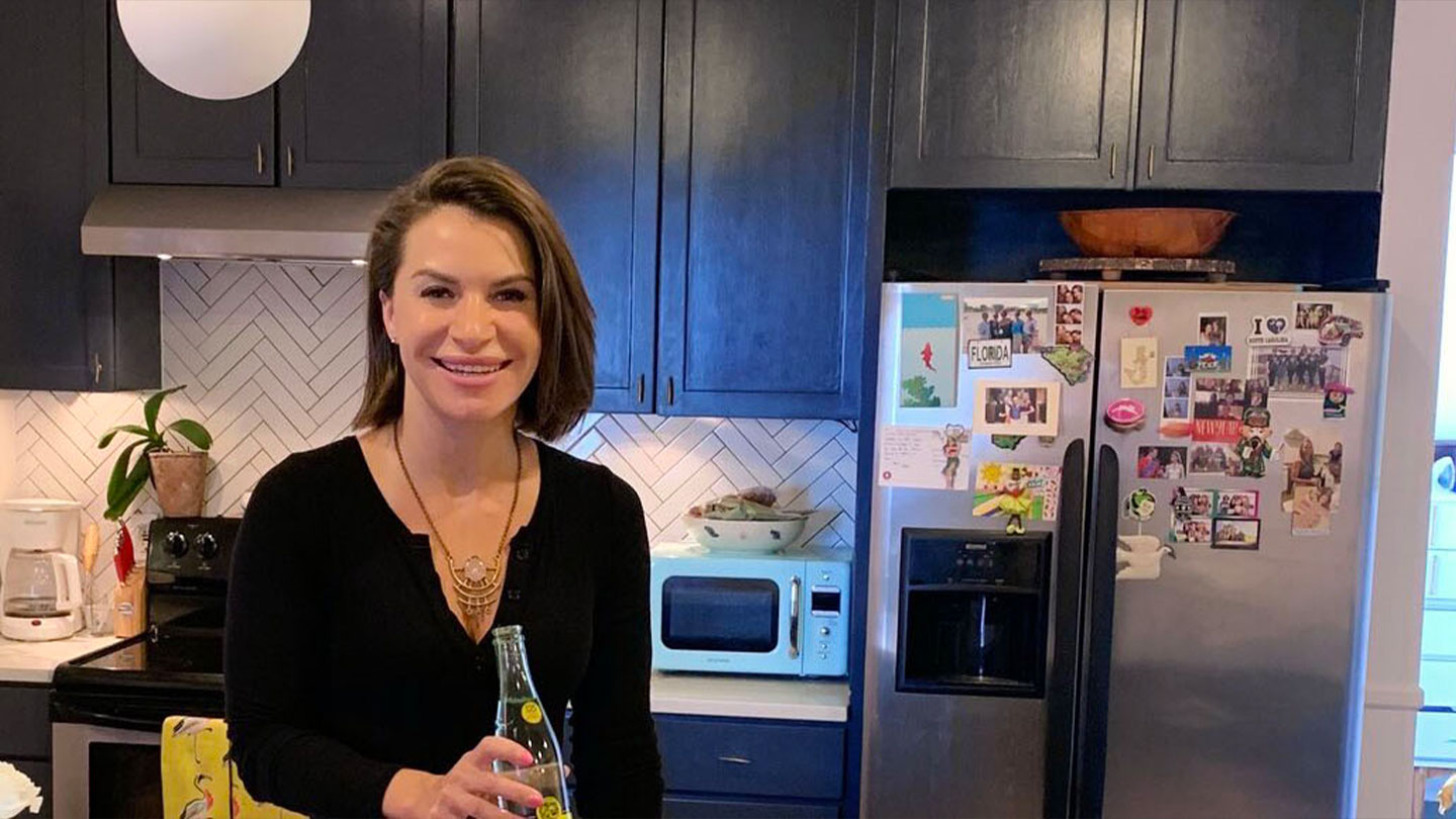 Wunderwell founder Lauren Hersh holding a Topo Chico bottle