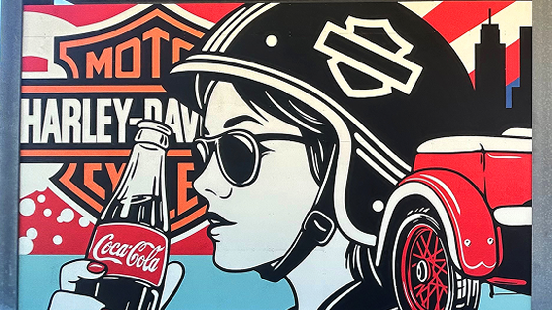 Video thumbnail of Greg Gossel's pop art mural featuring a woman in a helmet drinking Coca‑Cola.