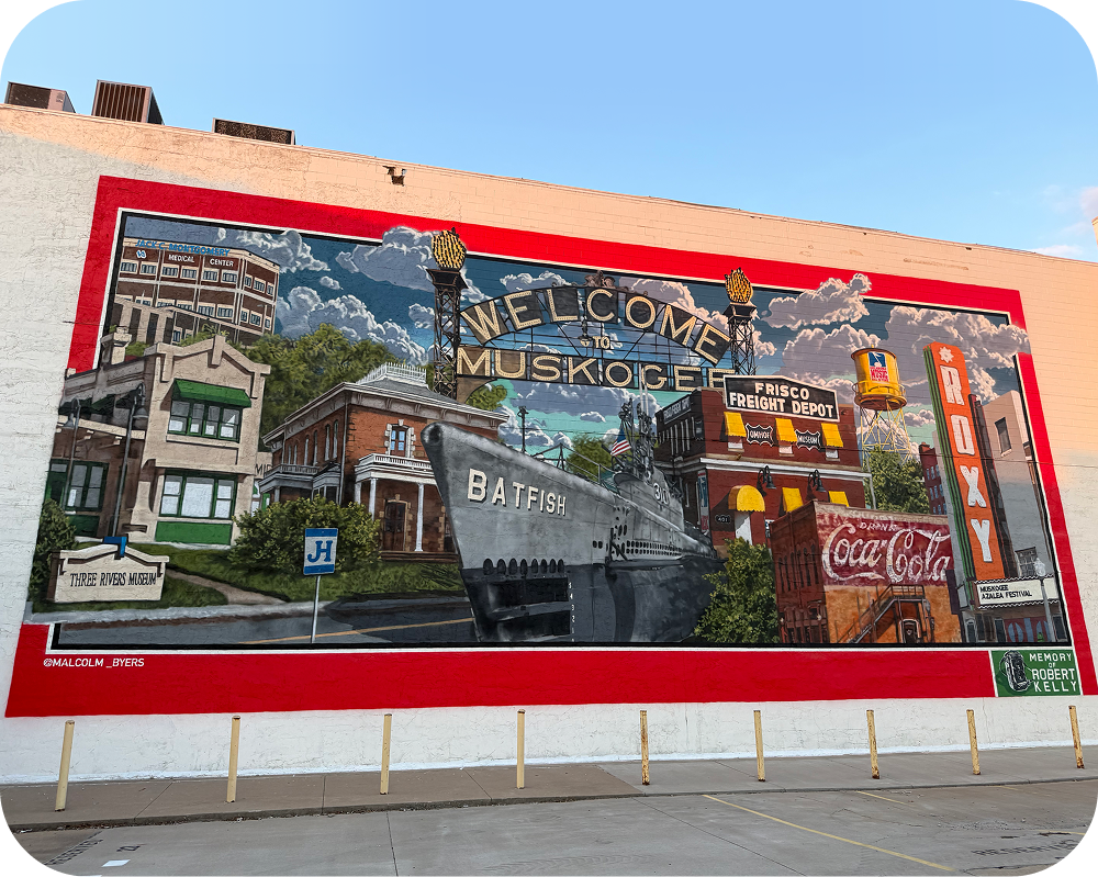 Angled view of Malcolm Byers' Muskogee America 250 mural featuring the USS Batfish and a vintage Coca-Cola sign.