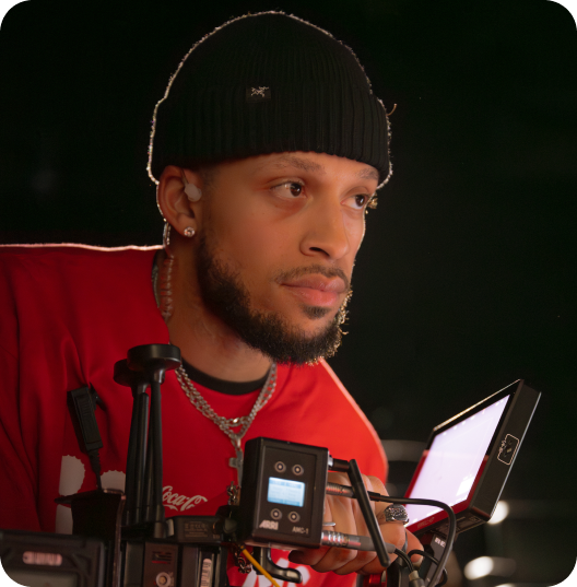 Camera operator in Coca-Cola shirt filming on Cinemark Refreshing Films set
