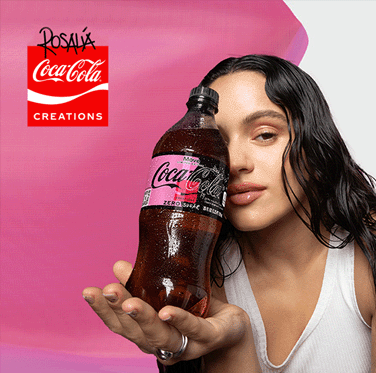 Rosalía holding a bottle of Coca-Cola
