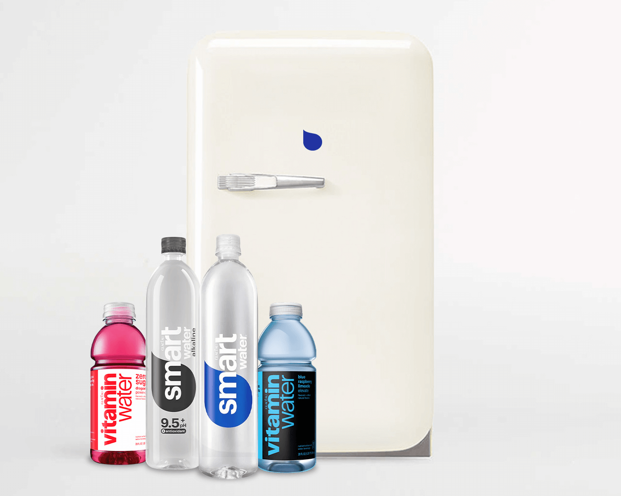 Refrigerator with a bottles of smartwater and vitamin water