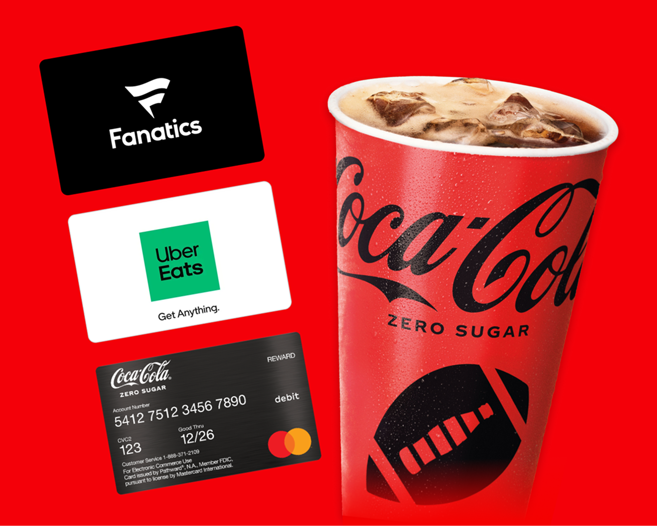 Coca-Cola Zero Sugar cup with a football design, displayed alongside Fanatics, Uber Eats gift cards, and a Coca-Cola Rewards debit card, highlighting gifts and trips campaign.