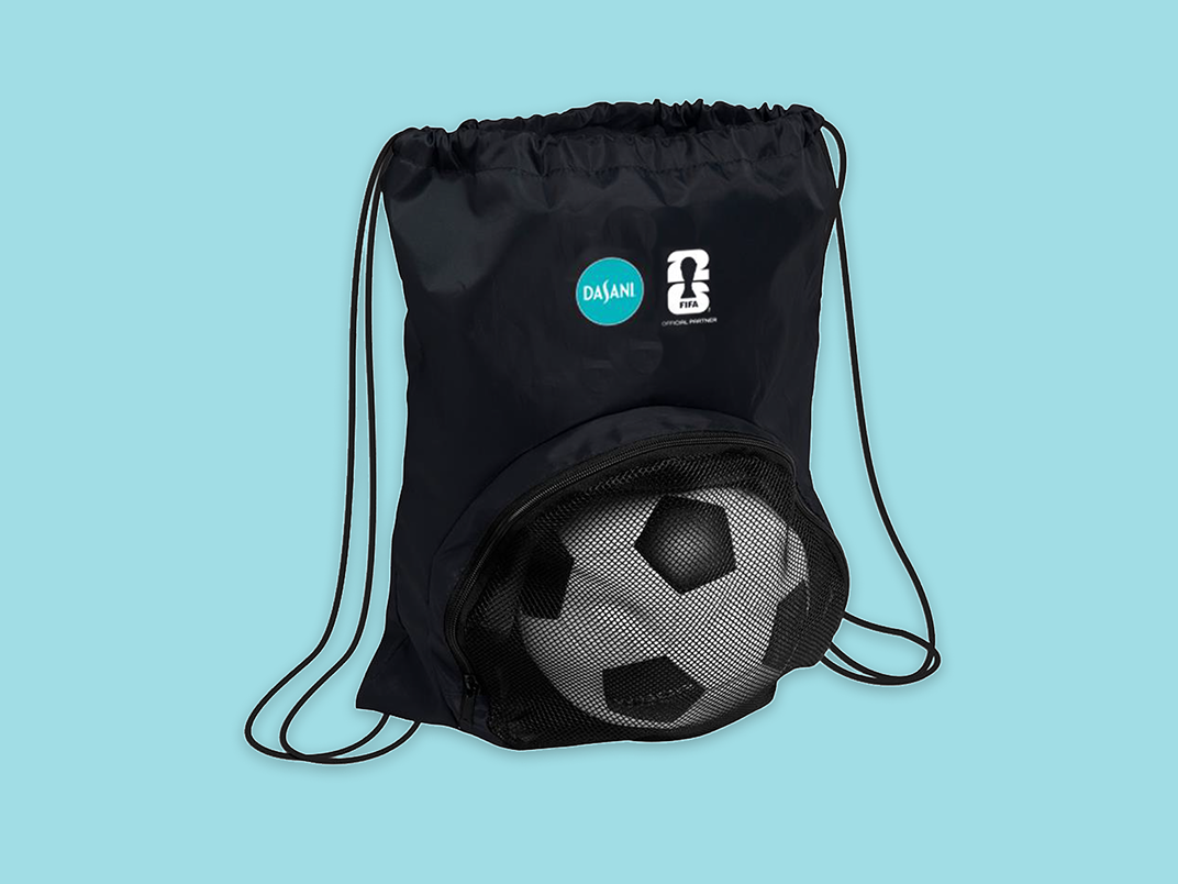 Black drawstring sports bag with DASANI and FIFA logos and mesh pocket holding classic black and white soccer ball on aqua background.