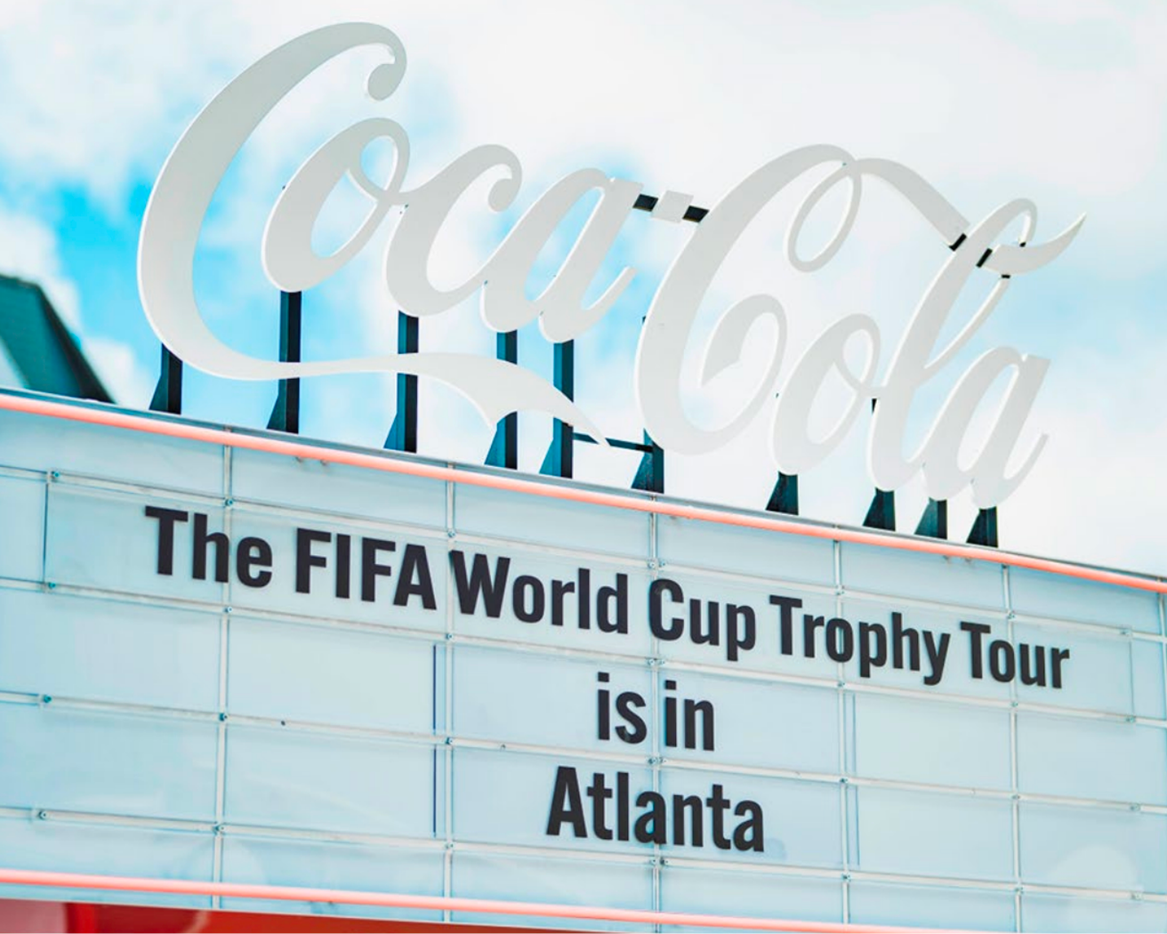 Coca-Cola marquee sign announcing the FIFA World Cup Trophy Tour stop in Atlanta, USA