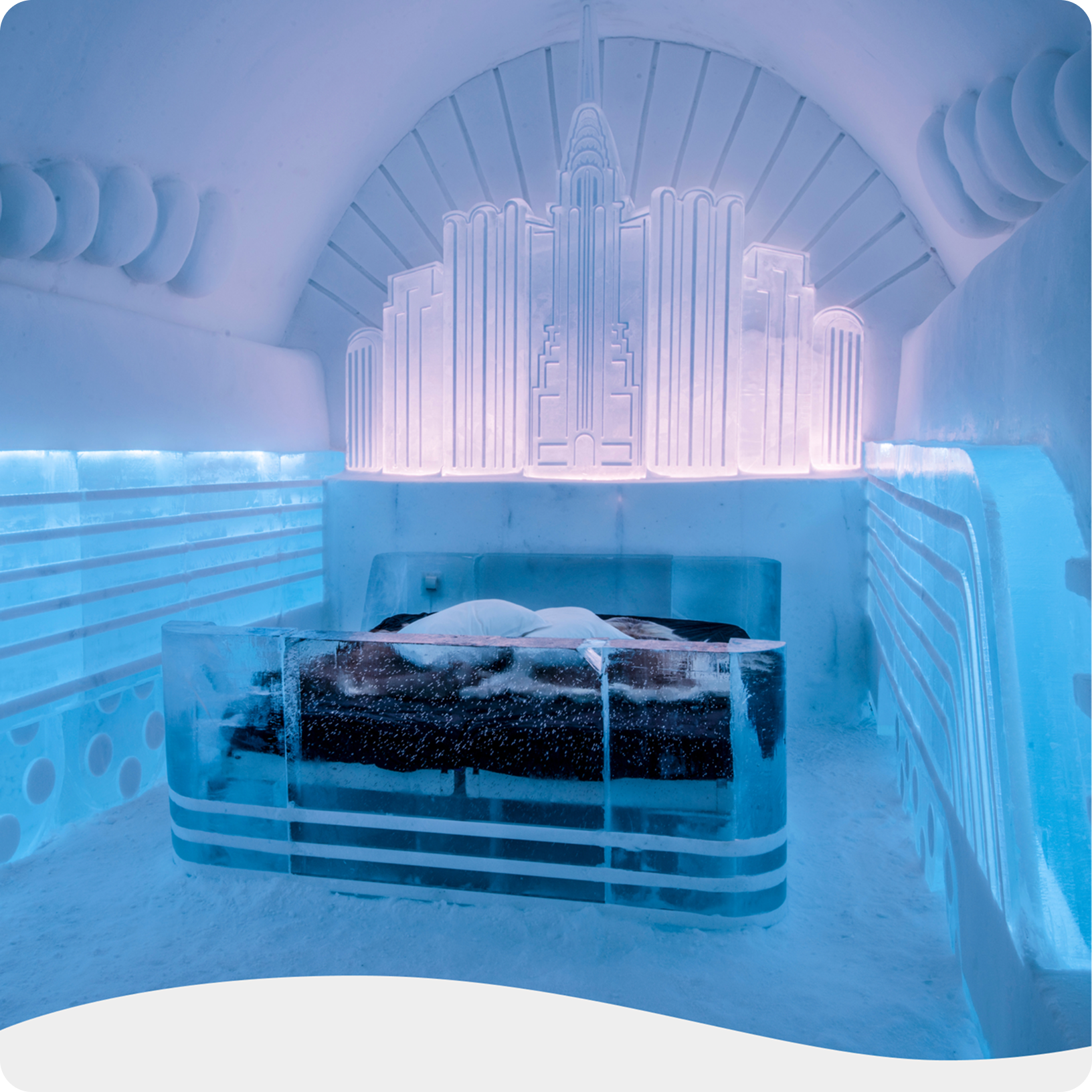 An ice bed sits at the center of a stunning room, its walls and floor also crafted entirely from ice