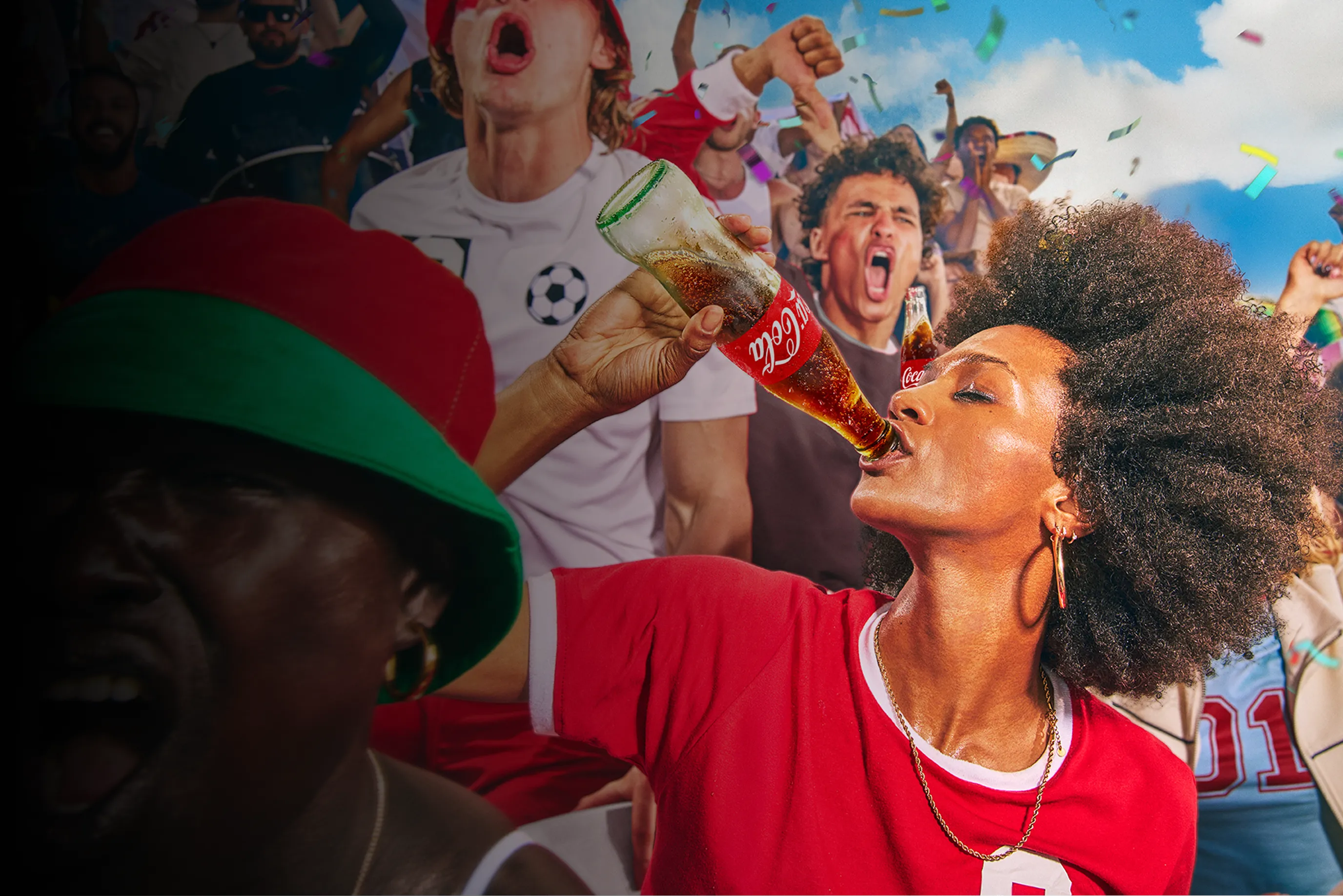 Woman enjoying a glass Coca-Cola bottle amidst a cheering crowd for the Soccer Central campaign hero banner.