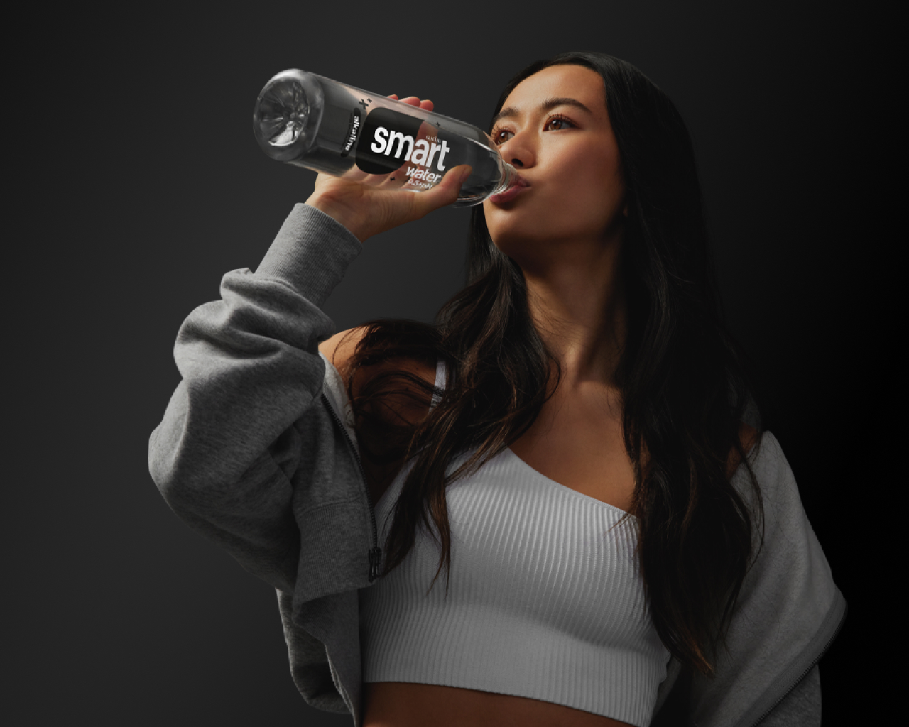 woman drinking smartwater alkaline with antioxident