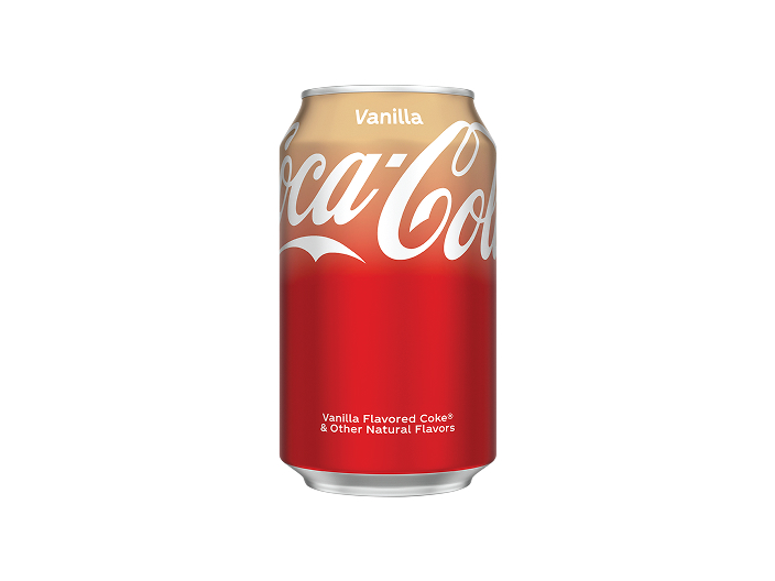 Lata de Coca-Cola sabor Vanilla con degradado de color beige a rojo, sobre fondo blanco. Incluye la palabra "Vanilla" en la parte superior, el logotipo de Coca-Cola en escritura blanca y el texto "Vanilla Flavored Coke® & Other Natural Flavors".