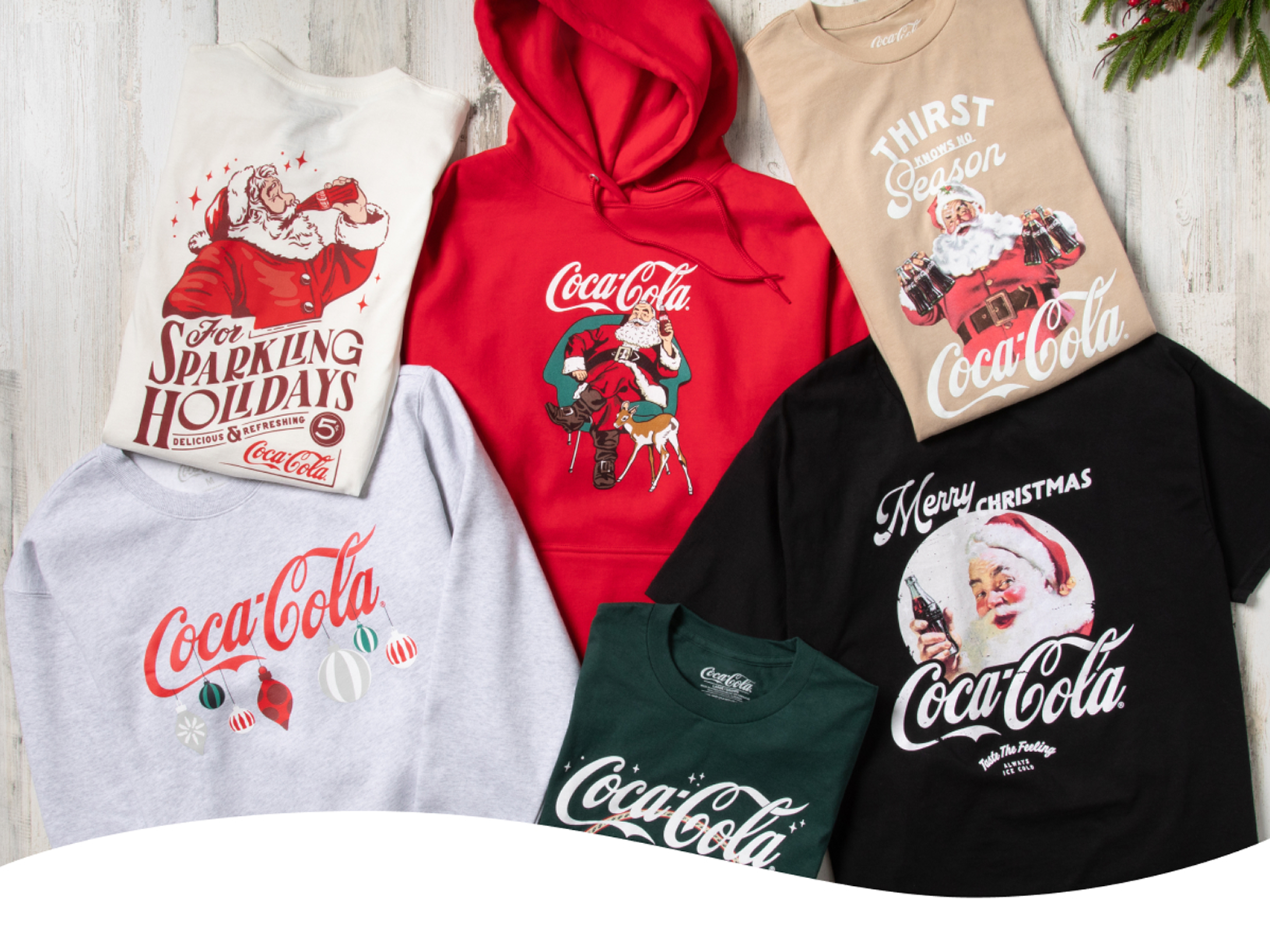 Camisetas y sudaderas de la marca Coca-Cola con imágenes de Santa Claus