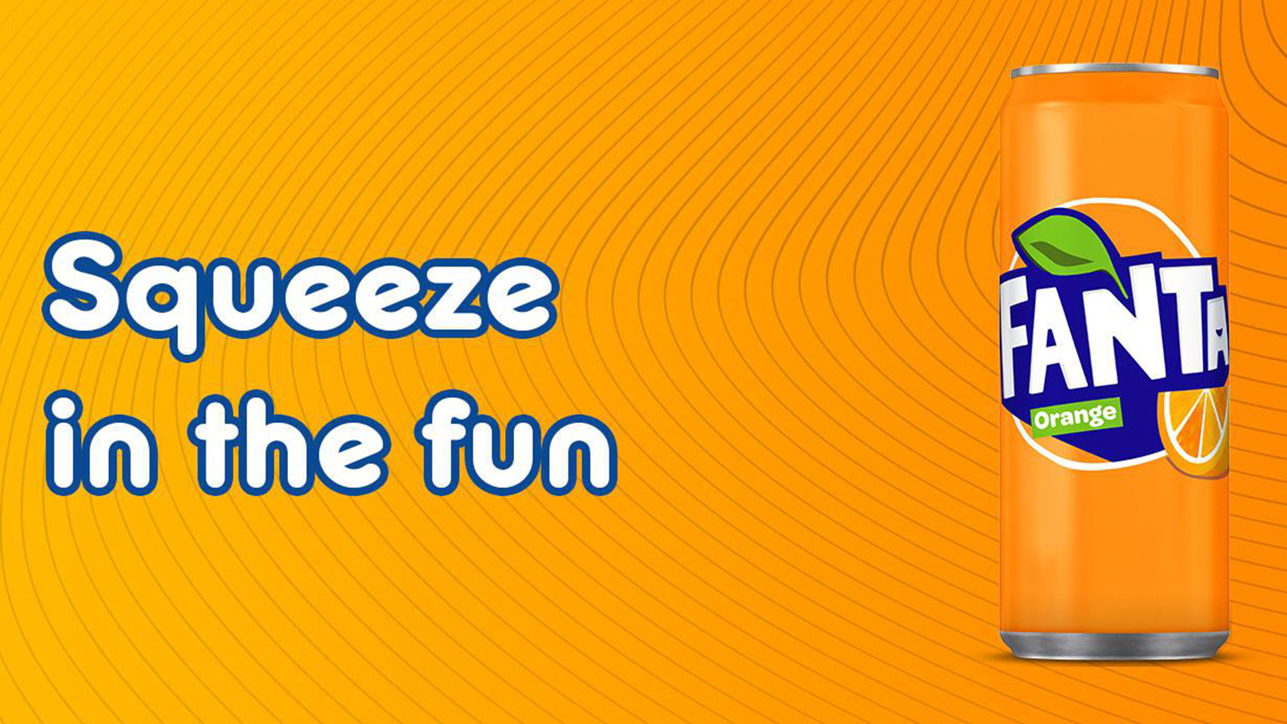 Fanta Orange can on orange background with the phrase 'Squeeze in the fun' placed beside it
