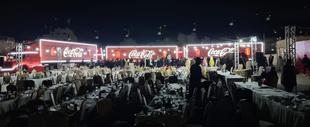 An open view of the Coca-Cola Caravan event at night