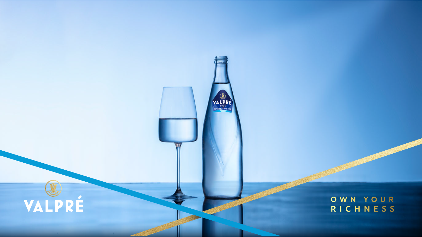 Brand Valpre drinks - a woman and a man sat enjoying a drink at a bar