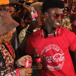 People on a party holding Coca-Cola