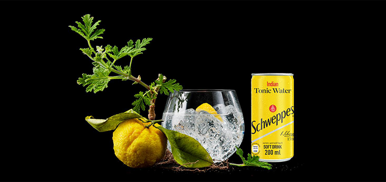 Glass of Schweppes drink